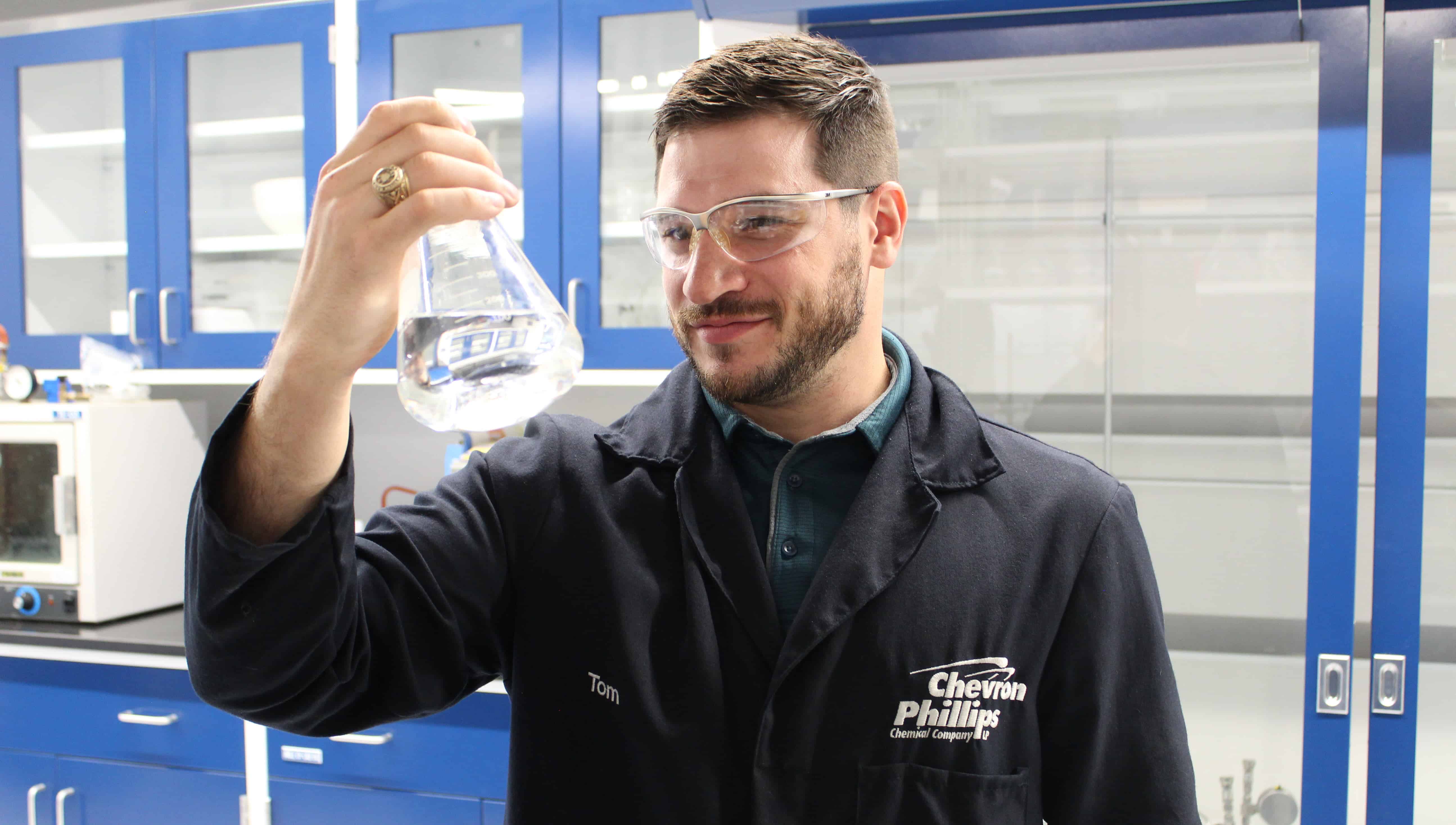 Dr. Tom in a Lab with a Beaker