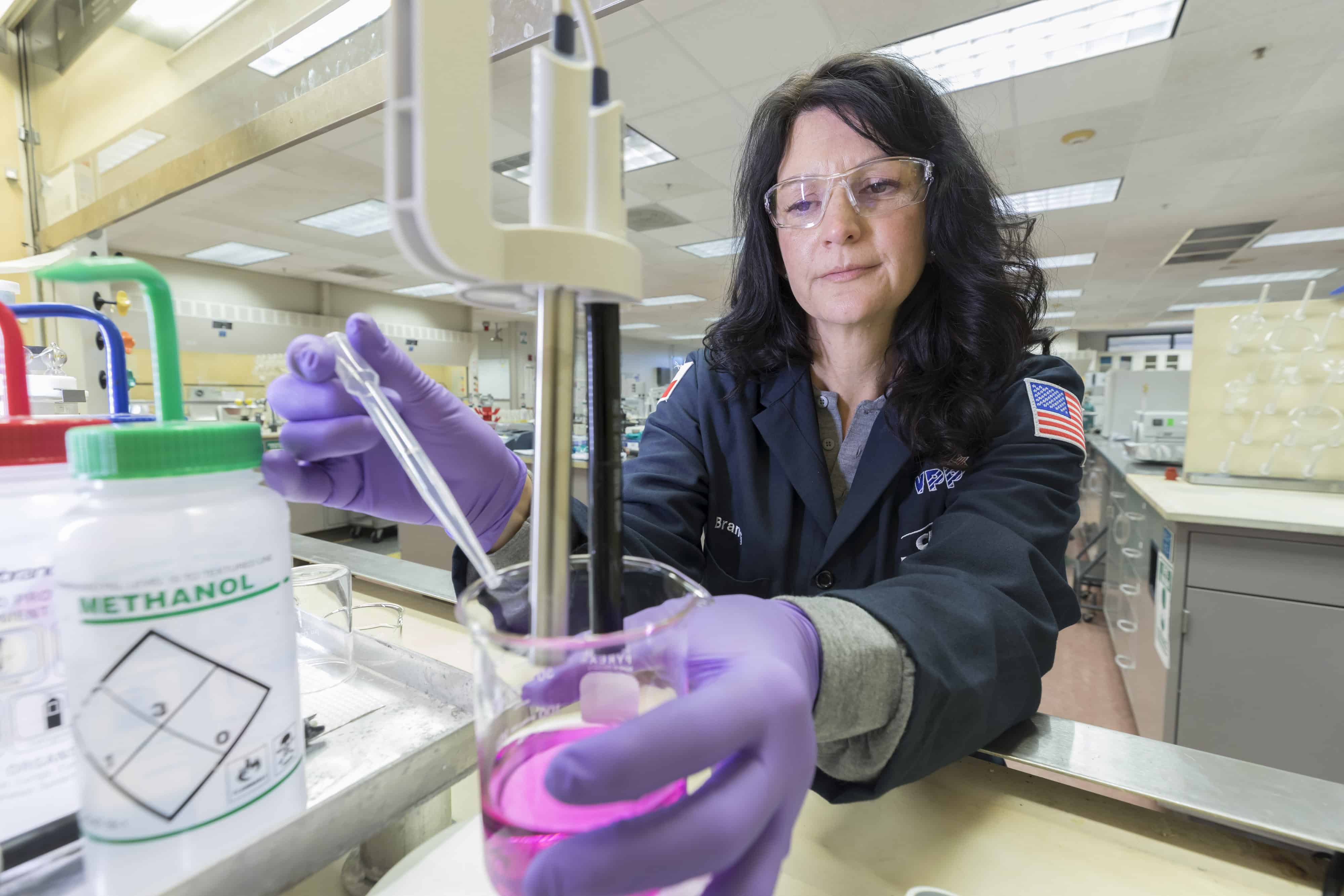 Researcher at Kingwood Facility Working in a Lab