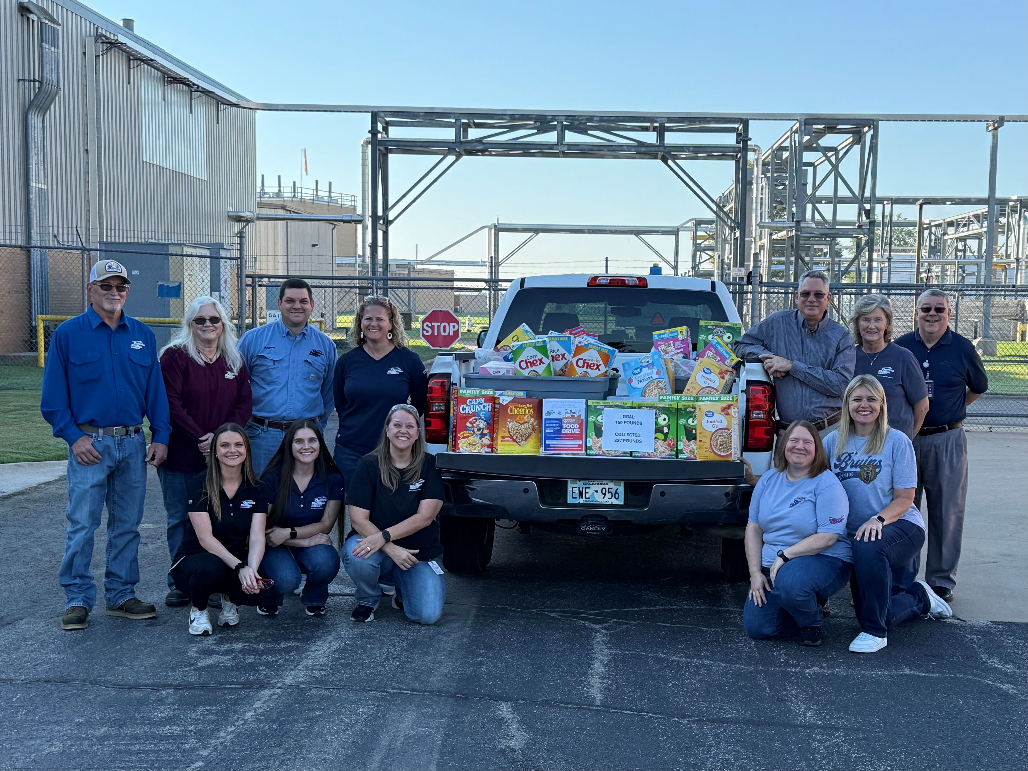 Group of employees with food drive donations