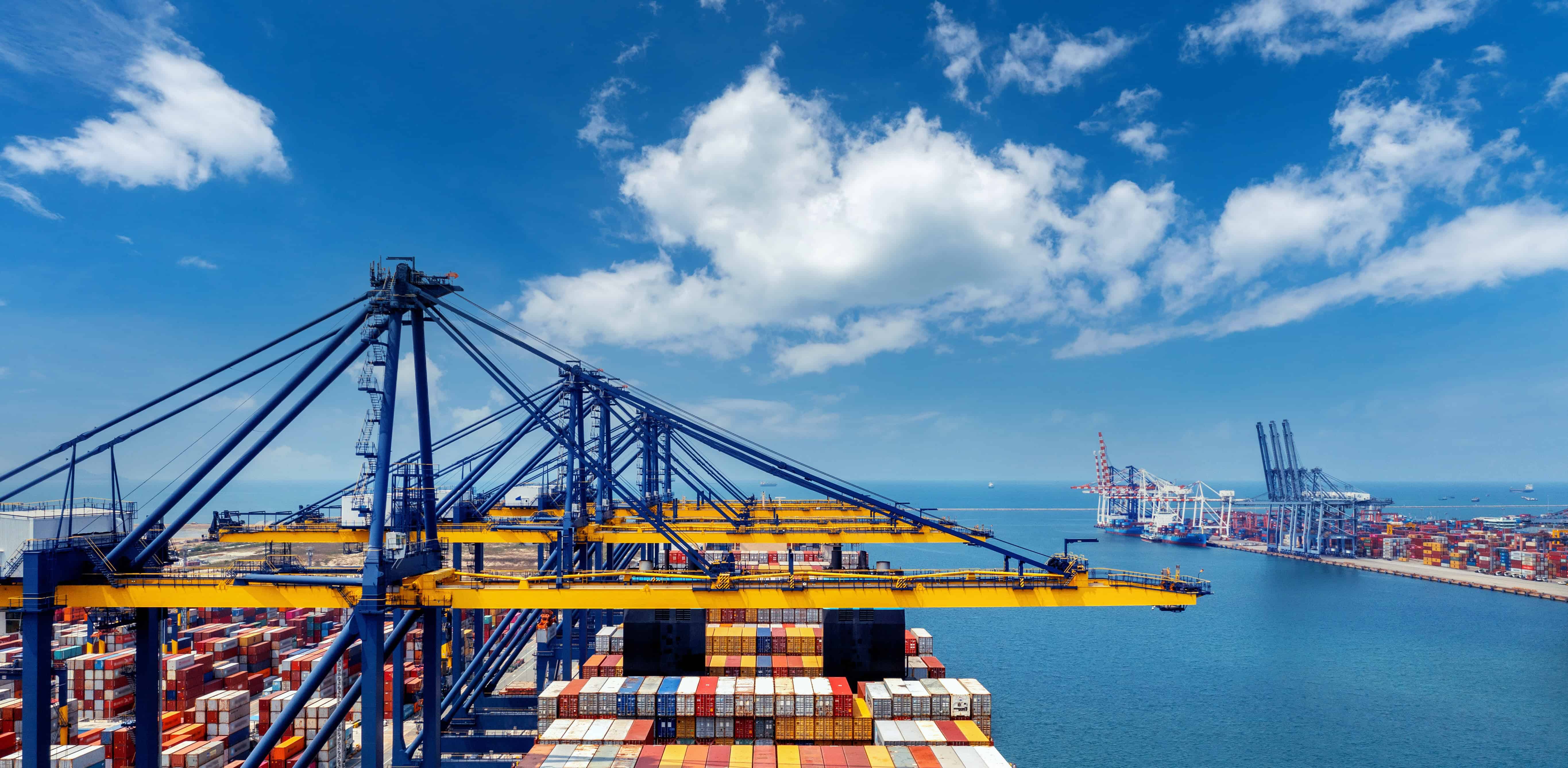 Port with shipping containers and cranes
