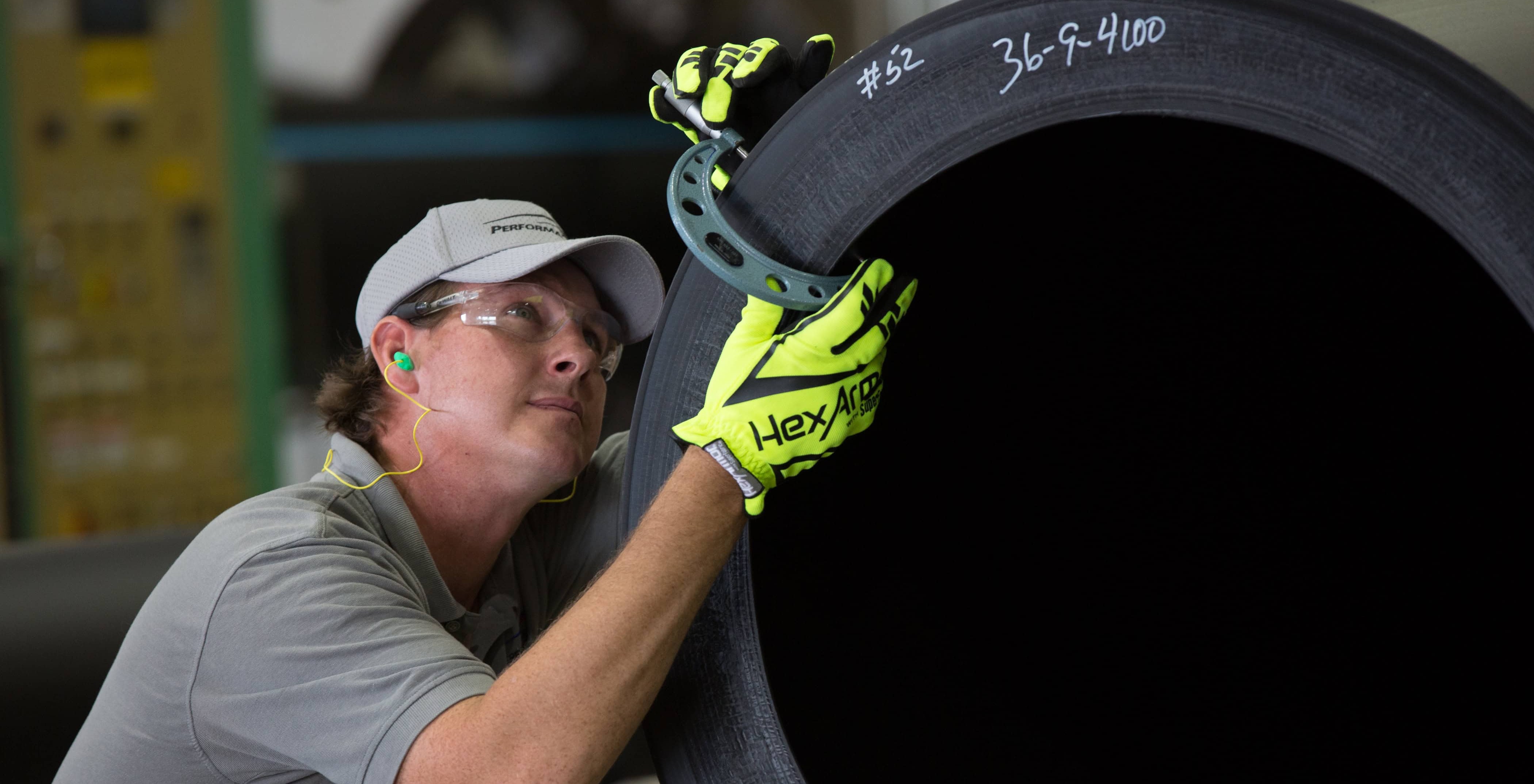 Performance Pipe Employee Checking Pipe Gauge